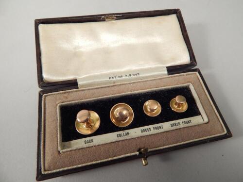 A set of four collar studs