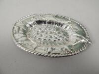 An oval silver dish