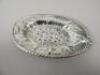 An oval silver dish