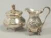 A Continental white metal cream jug and sugar bowl