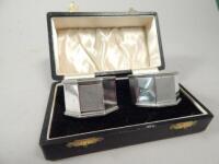 A pair of George V hexagonal part engine turned silver napkin rings