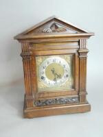 A 20thC German oak mantle clock