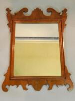 A mahogany fret framed wall mirror