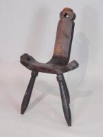 An early 20thC stained pine hall or lovers' type chair on turned legs.