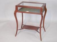 An Edwardian mahogany display table