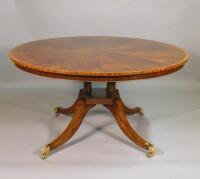 A large circular mahogany dining table