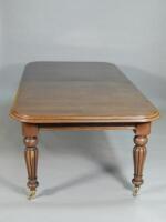 A Victorian style mahogany extending dining table