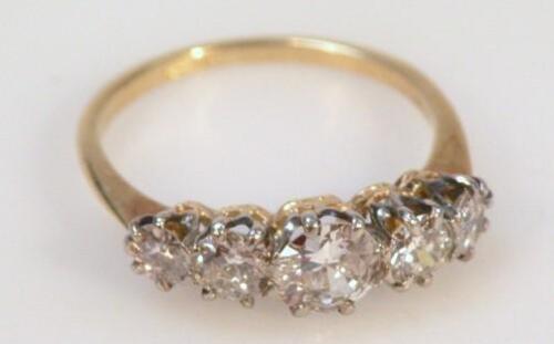 A diamond five stone ring