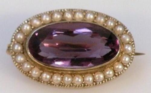 An oval brooch