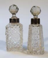 An Edwardian silver and cut glass perfume bottle