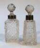 An Edwardian silver and cut glass perfume bottle