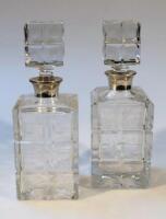 A pair of Elizabeth II silver and cut glass decanters