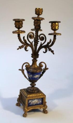 A gilt metal garniture candelabra