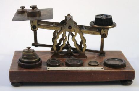 A set of brass postal scales