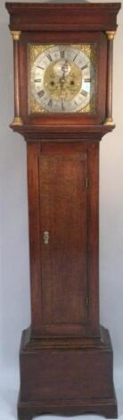 An oak longcase clock