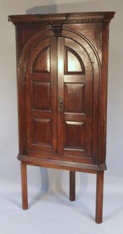 An oak corner cupboard