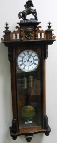 A walnut and ebonised cased twin weight Vienna wall clock