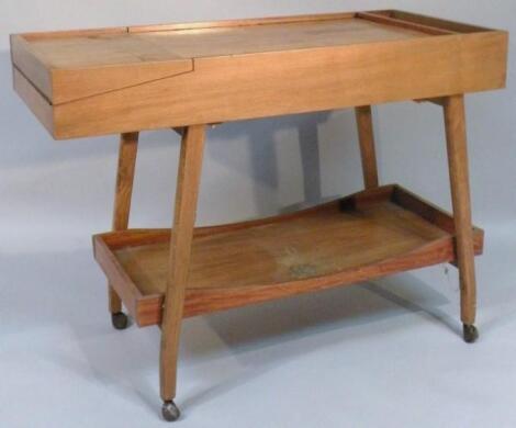 A retro design teak sewing trolley