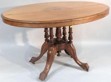 A walnut and inlaid loo table