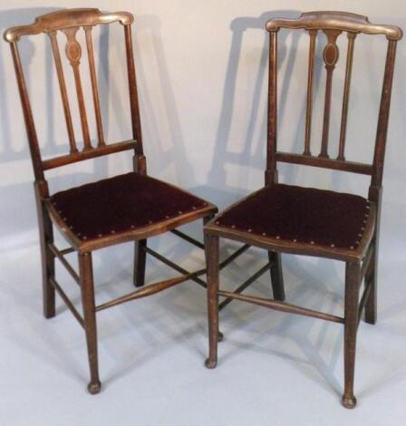 A pair of Edwardian mahogany and part inlaid salon chairs