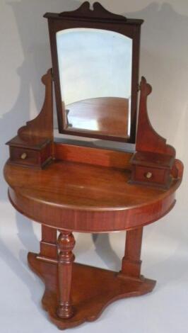 A Victorian mahogany demi-lune dressing table