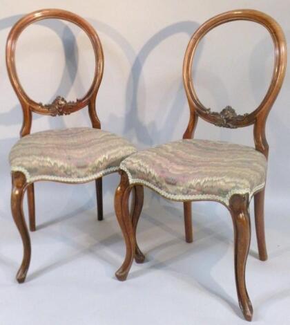 A pair of Victorian mahogany framed spoon back dining chairs