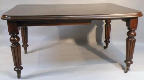 A Victorian mahogany extending dining table