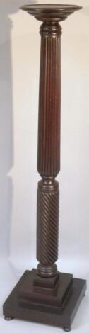 A mahogany torchere