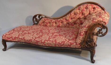 A mahogany framed chaise long