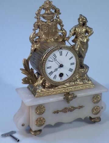 A gilt metal and marbled mantel clock