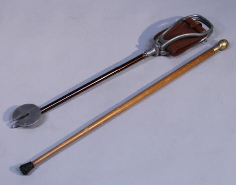 A brass top compass walking stick