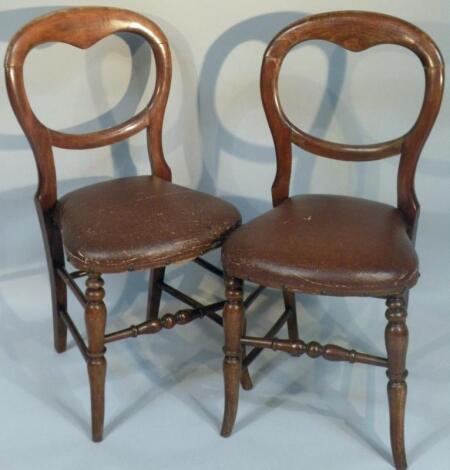 A pair of Victorian and mahogany balloon back salon chairs