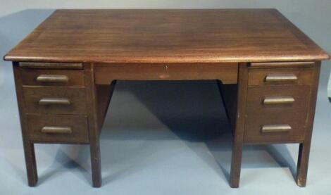 An oak pedestal desk