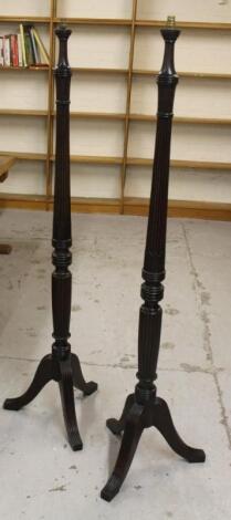 A pair of mahogany standard lamps