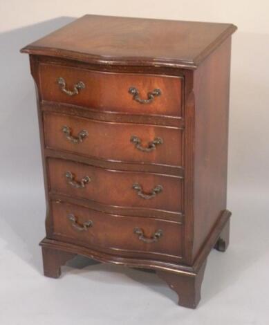 A mahogany finish serpentine chest