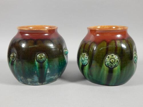 A pair of Linthorpe pottery globular vases