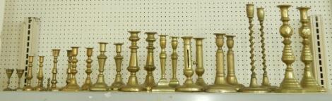 A collection of 19thC and later brass candlesticks