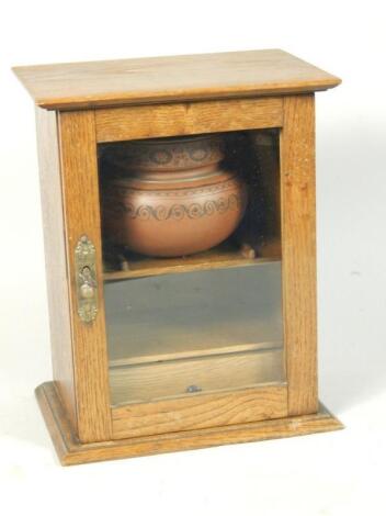 An Edwardian oak smokers cabinet