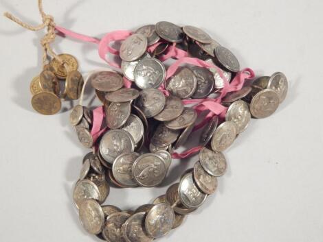 A large quantity of tunic or uniform buttons