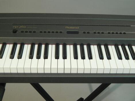 A Roland EP76 electric piano and stand.