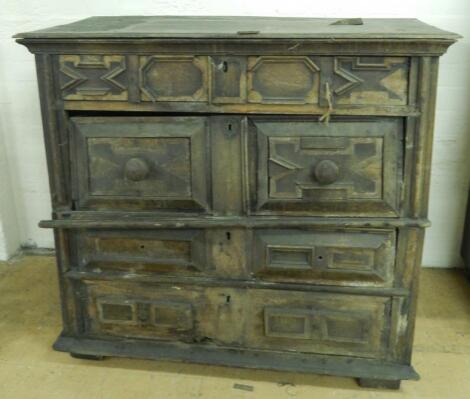 A 17thC panelled oak chest of drawers