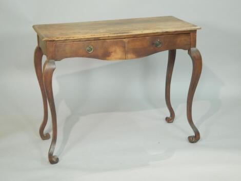 A continental pine and fruitwood side table