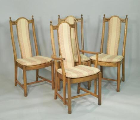 A set of four Ercol light elm dining chairs