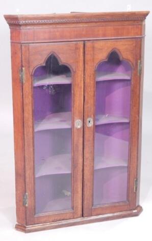 A 19thC mahogany and oak hanging corner cabinet