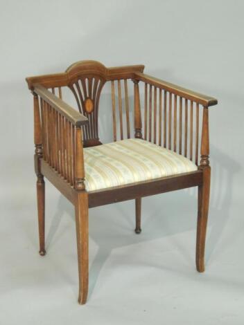 An Edwardian mahogany and marquetry armchair