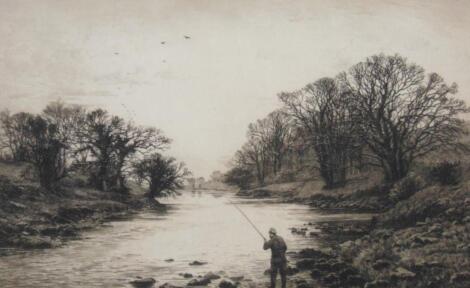 After Fred Slocombe (1847-1920). A river scene with a fisherman playing a fish