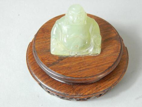 A 20thC green oriental hardstone figure of Pudai