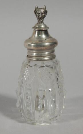 An Edwardian cut glass and silver mounted scent bottle