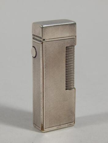 An Art Deco style silver plated Alfred Dunhill cigarette lighter.