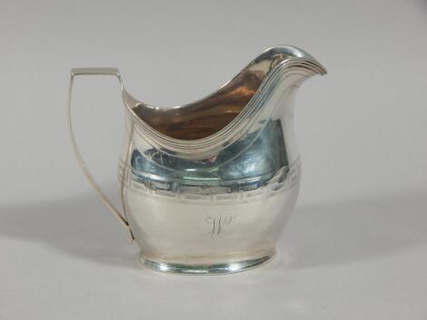 A George III silver helmet shaped cream jug